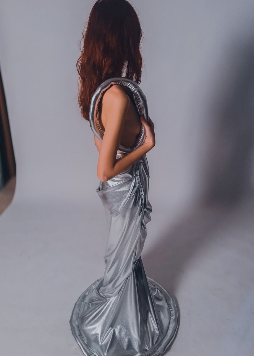 Back view of a silver open-back gown